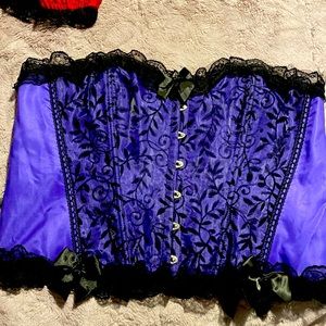 Purple satin and lace bustier with hock closure in the front.